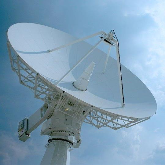 Close-up of a ground station antenna pointed at the sky
