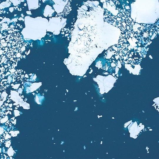 Aerial view of chunks of ice floating in the arctic