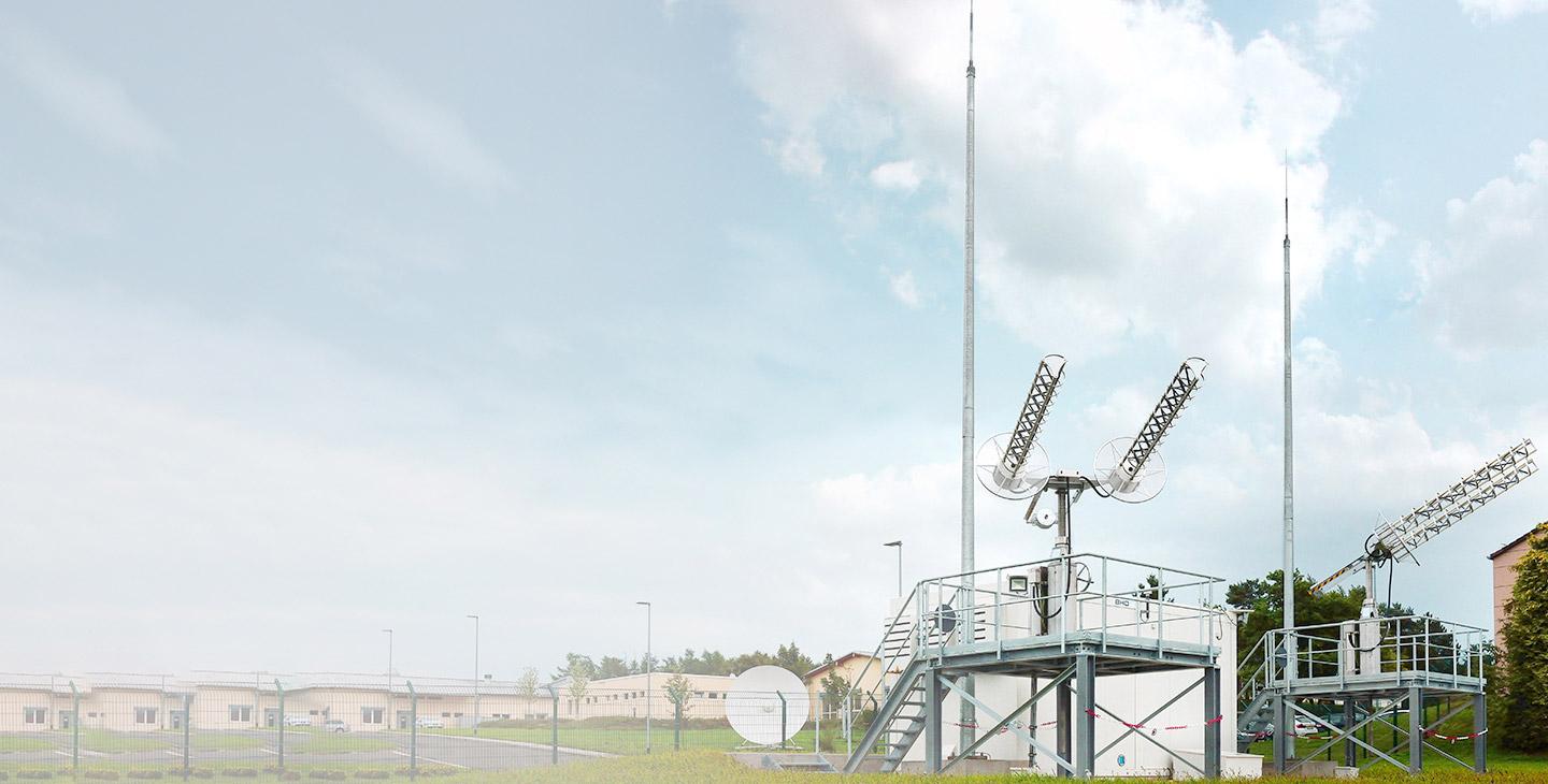 Two UHF SATCOM terminals mounted on top of metal platforms
